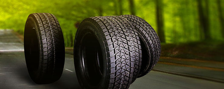 Car tire on summer road. Banner or panorama.